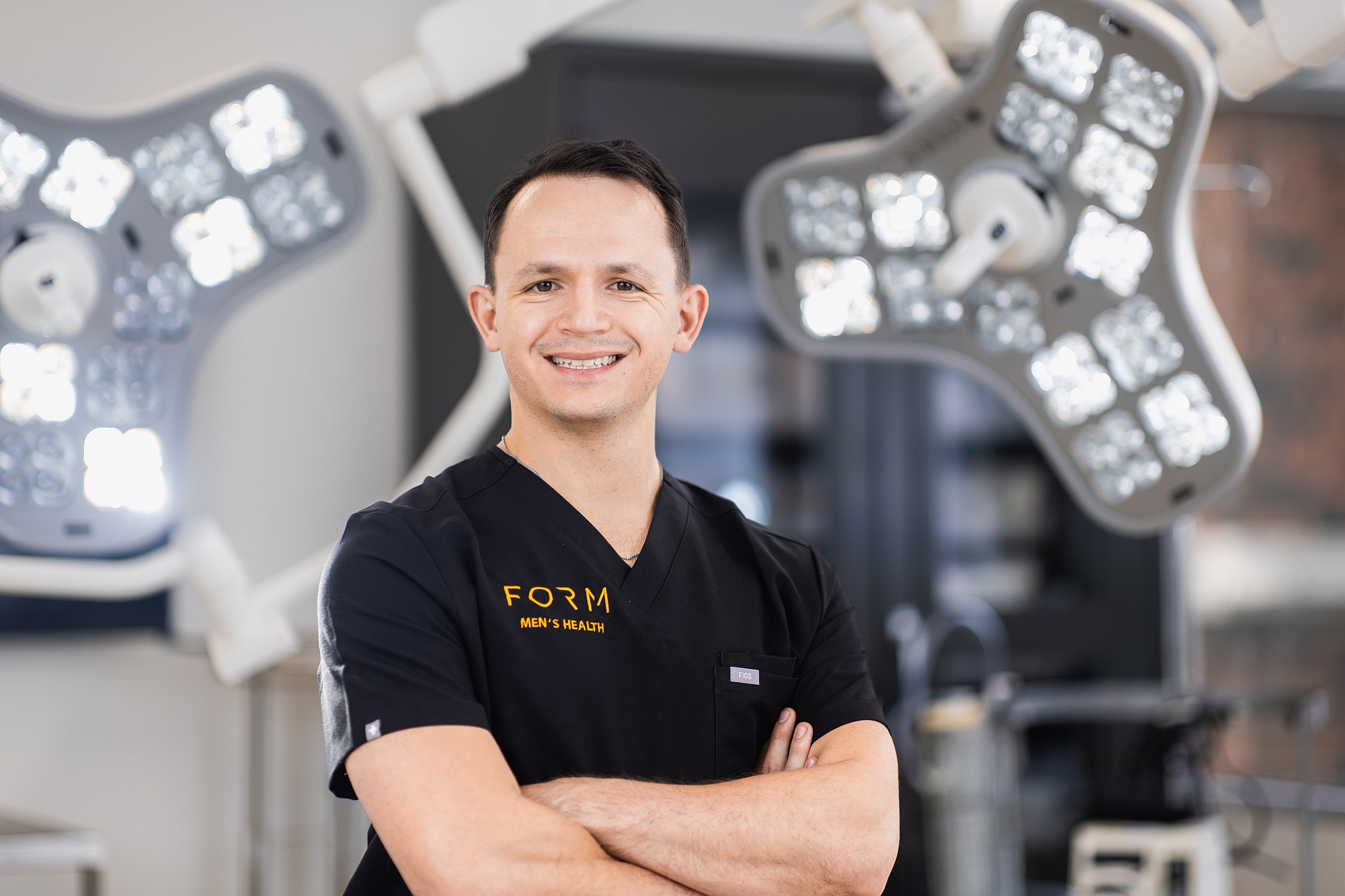 Male healthcare professional in medical environment.