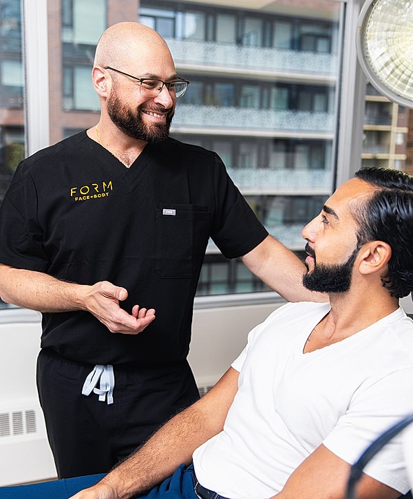 Medical professional consulting with a patient.