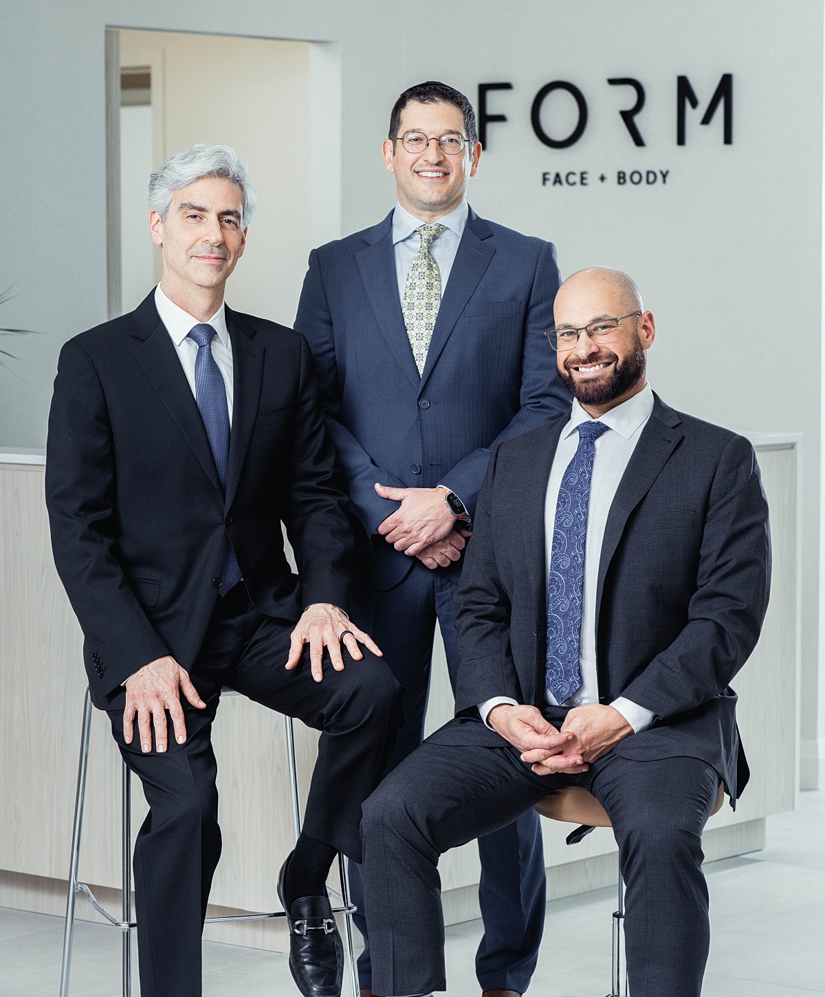 Three professionals at FORM Face + Body clinic.