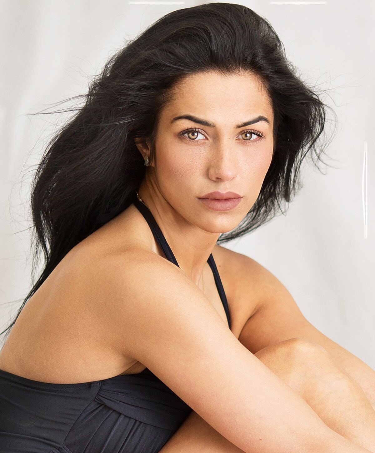 Model with long hair and striking gaze.