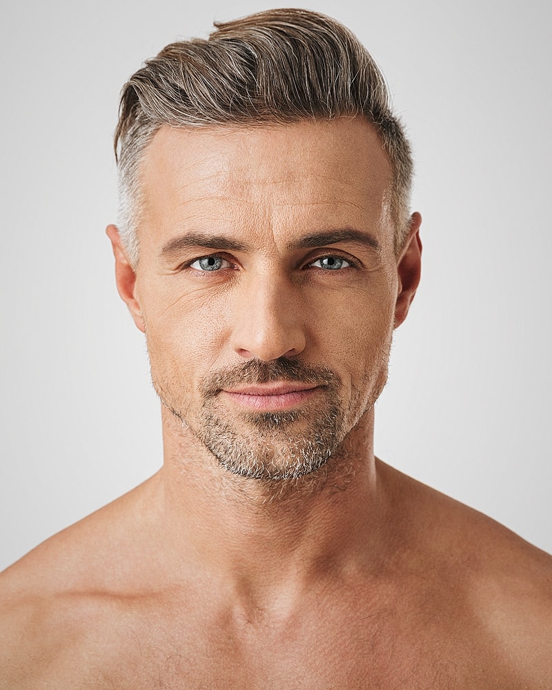 Attractive man with gray hair and blue eyes