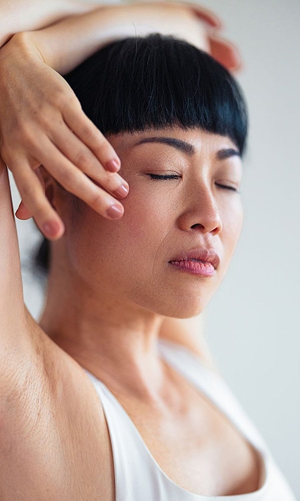 Woman with closed eyes and relaxed expression