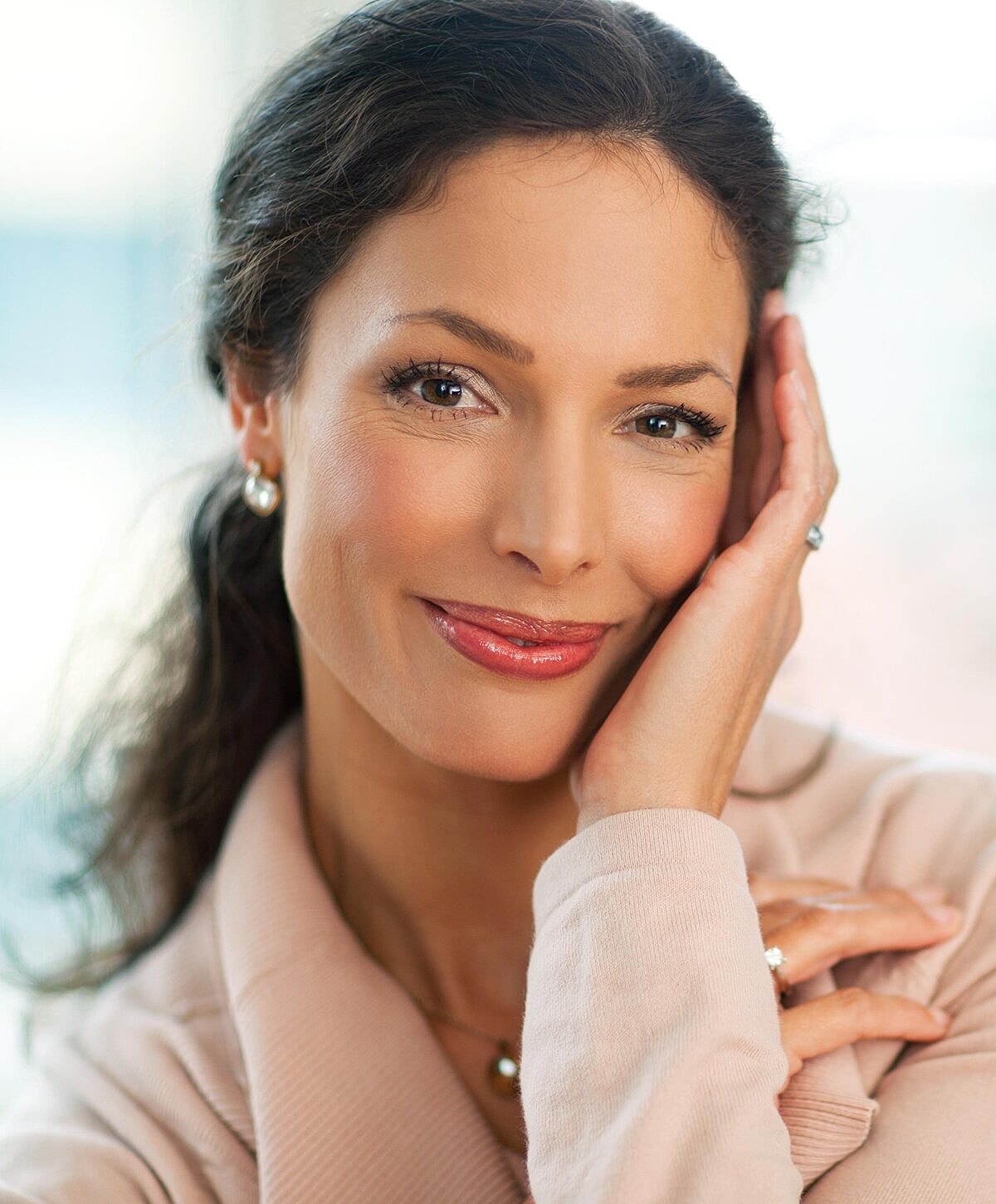 Smiling woman with elegant style and warm expression