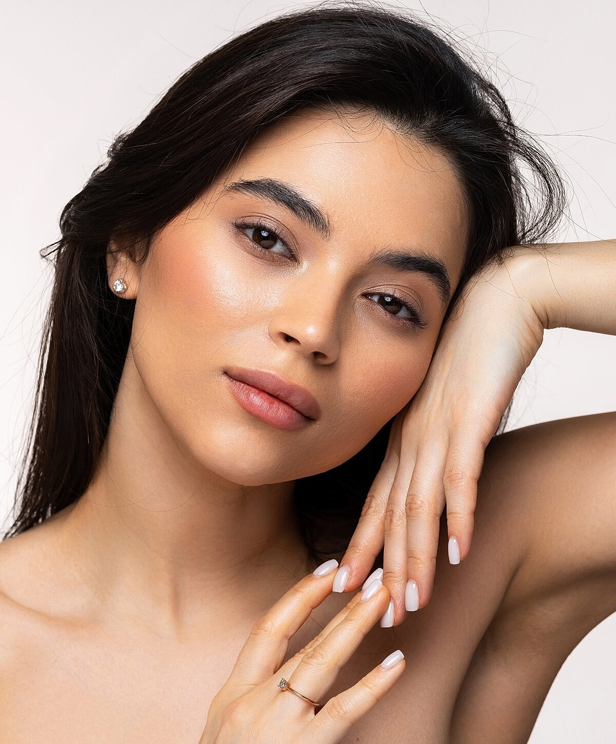 Close-up portrait of a woman with elegant pose.
