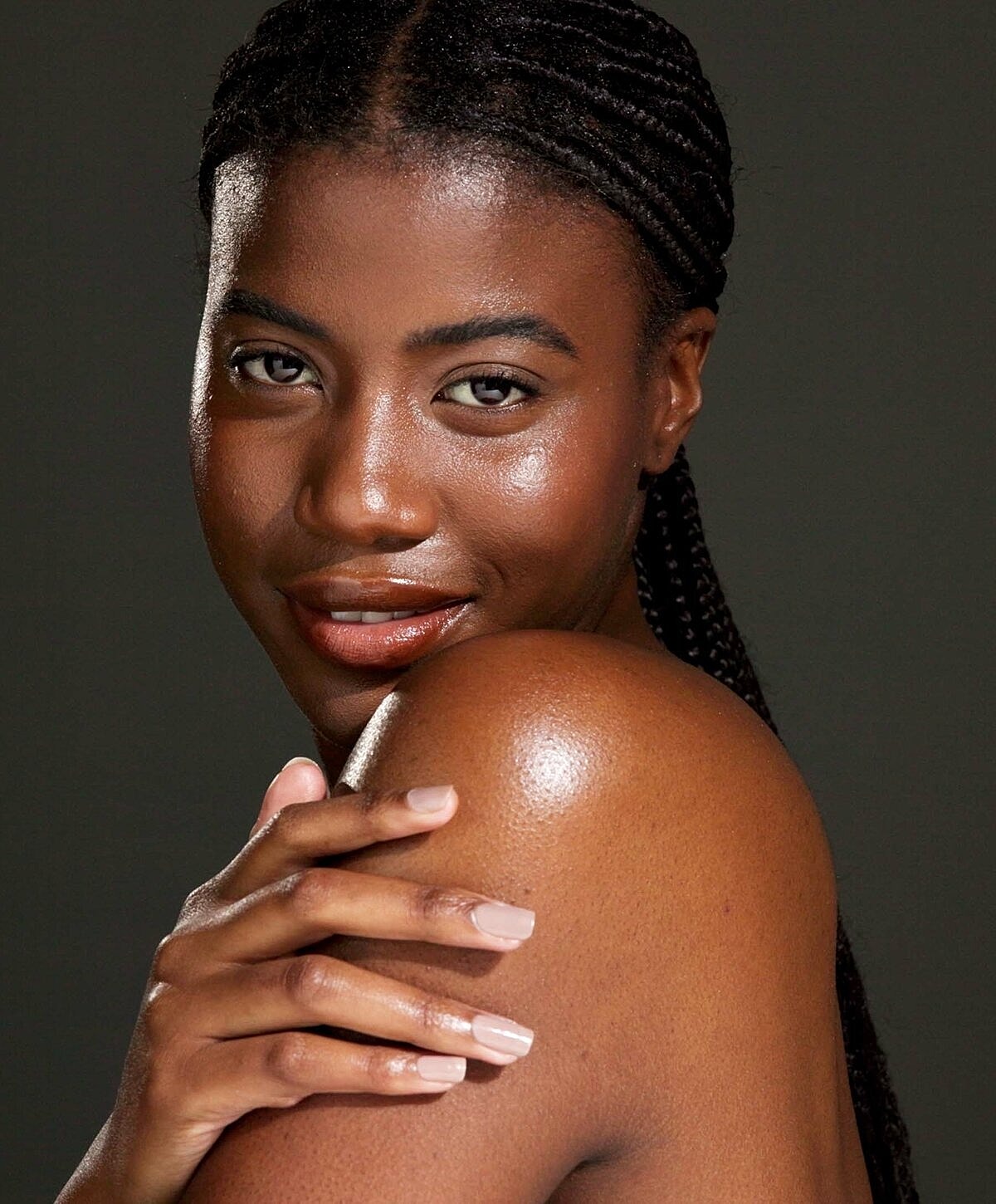 Portrait of a woman with braided hair.