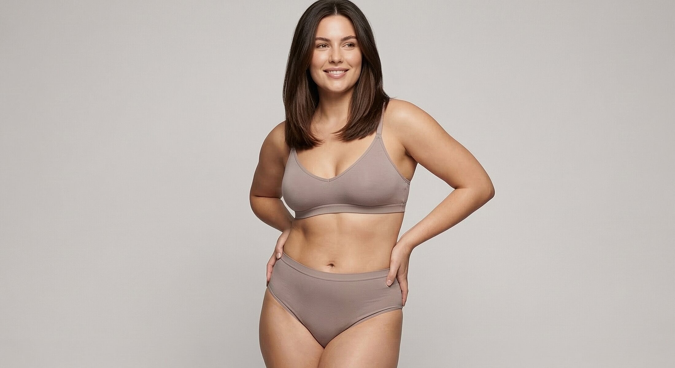 Model wearing a beige bra and high-waisted underwear.