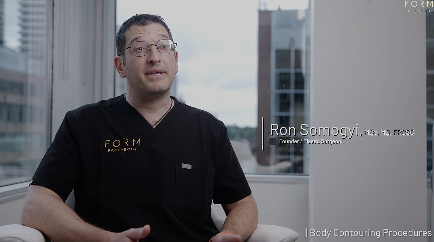 Plastic surgeon discussing body contouring procedures.